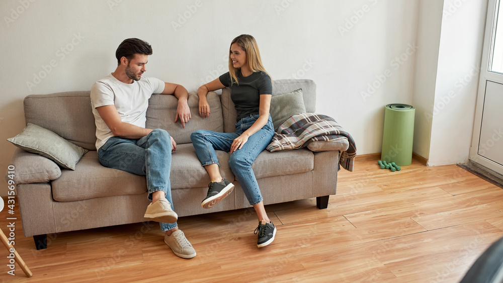 Top view on couple who are resting on the couch Top view on couple who are resting on the couch