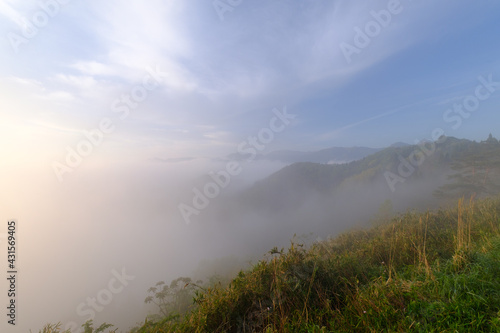 Morning walk on a foggy misty mountain