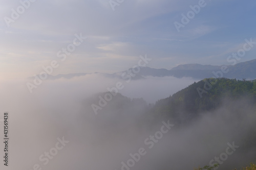 Morning walk on a foggy misty mountain