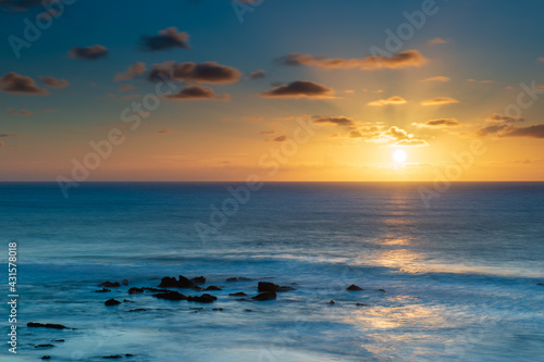 Beautiful sunset at Playa La Pared, Fuerteventura, Spain. Thanks to its perfect tides, the beach is famous by watersport fans and surfers. It is shallow at low tide; the water is cold.