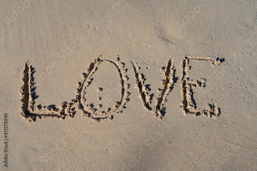 LOVE inscription on summer sandy beach. Relation ship and togetherness concept  © Hladchenko Viktor