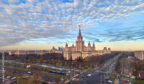 Aerial panoramic view of sunset campus buildings of famous Moscow university under dramatic cloudy sky in spring