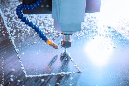 Closeup detail view of a cnc router during a steel layer cutting process