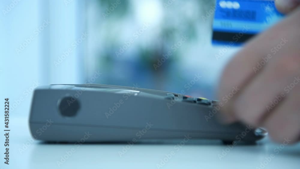 Payment By Card In Payment Terminal. Electronic Money And Shopping Concept. Slow Motion Effect. Close Up Payment By Card In Payment Terminal. Electronic Money And Shopping Concept. Slow Motion Effect. Close Up