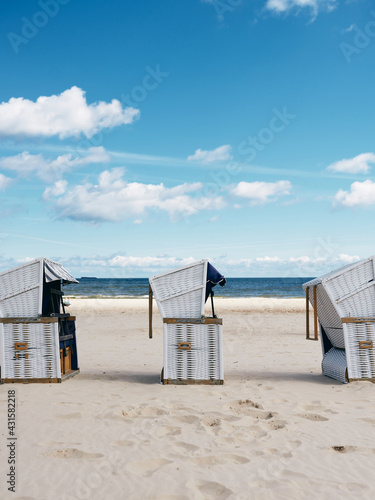 beach baskets for sunbathing on the sand by the sea,