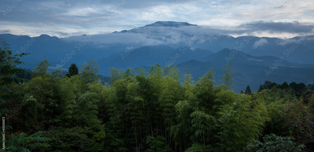 Mountain valley landscape. Japanese green forest. View of Nakasendo trail. Kiso Valley path and hike. Magome mountains panorama, Japan. Background.