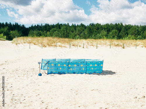 beach screen set up on the beach by the sea, sun protection on vacation
