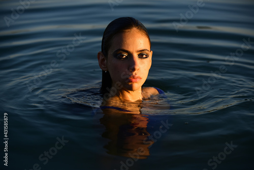 Sensual girl in water. Beauty woman. Fashion portrait. Summer beach. © Volodymyr