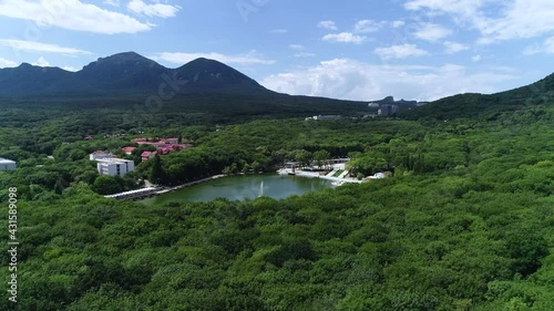 A small pond in the city, next to the mountain