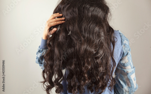 woman hand in long hair