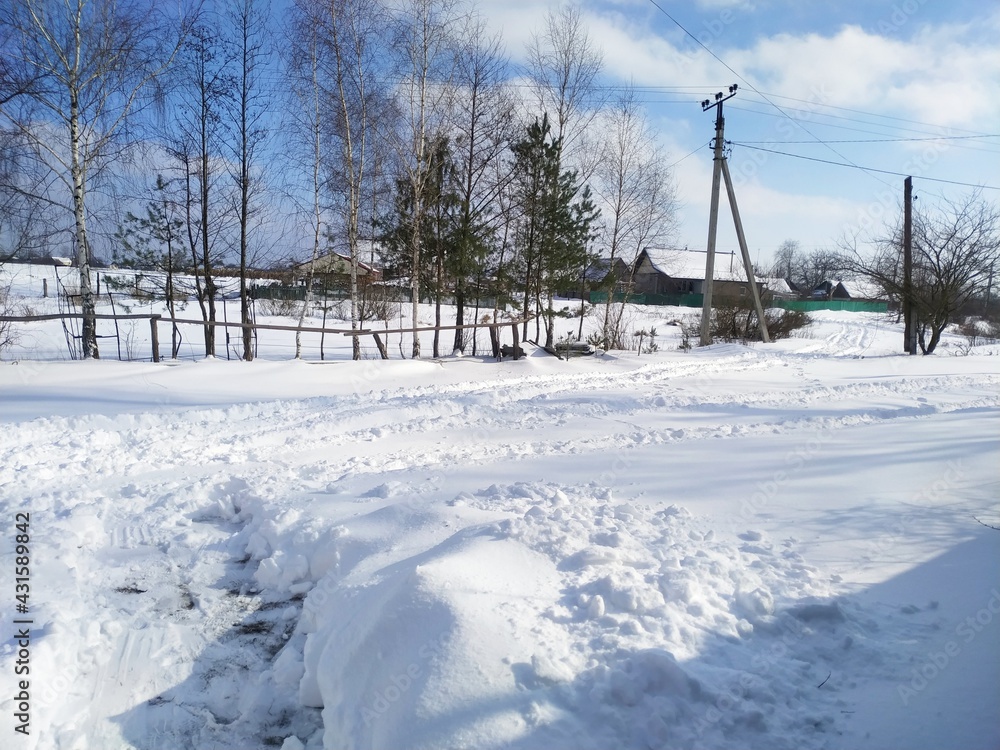 windmill in winter in village