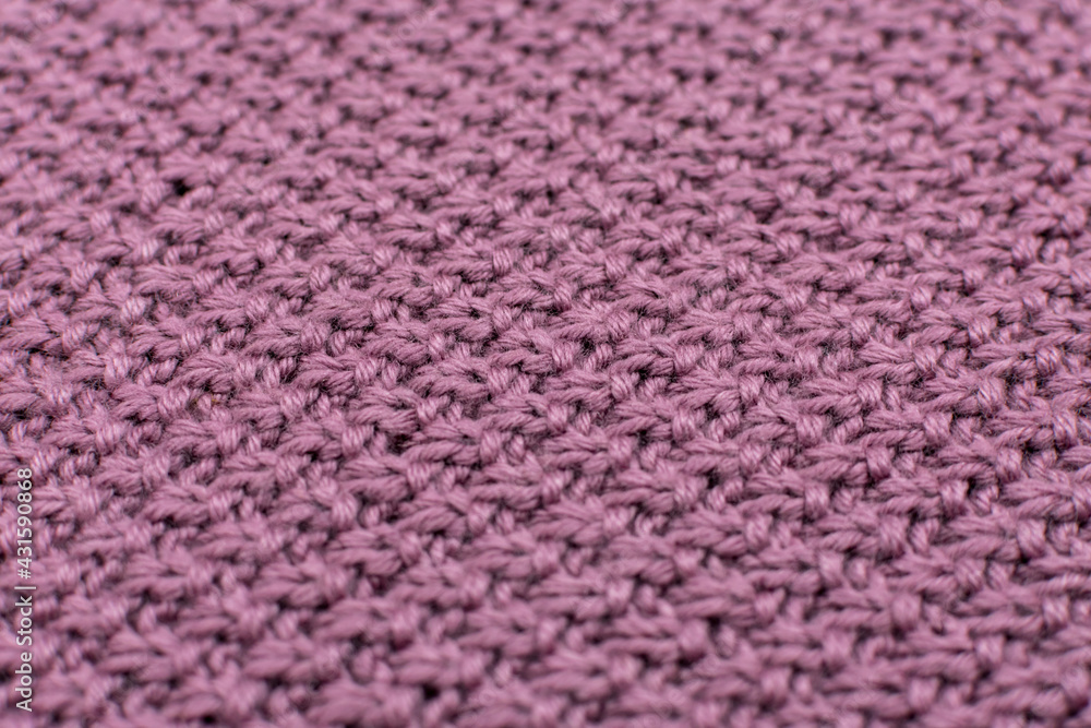 Knitted fabric pearl woolen background, close-up. The structure of the fabric with a natural texture. Fabric background. Knitted woolen background. Close-up. Knitted fabric pearl woolen background, close-up. The structure of the fabric with a natural texture. Fabric background. Knitted woolen background. Close-up.