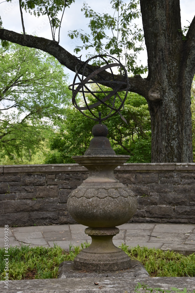 A sundial trying to do its job in the shade