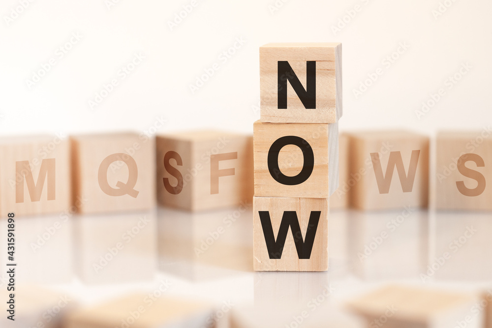 word now from wooden blocks with letters, concept word now from wooden blocks with letters, concept