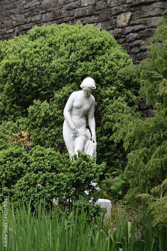 Statue of a beautiful woman about to bathe