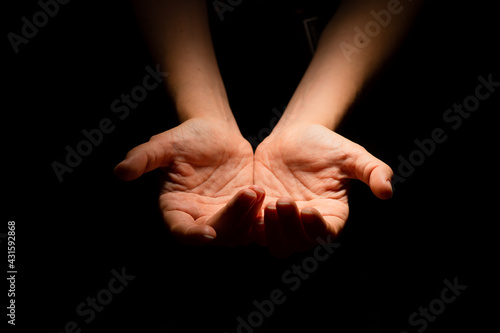 Two hands with open palms turned up, offering or giving something, a handful.