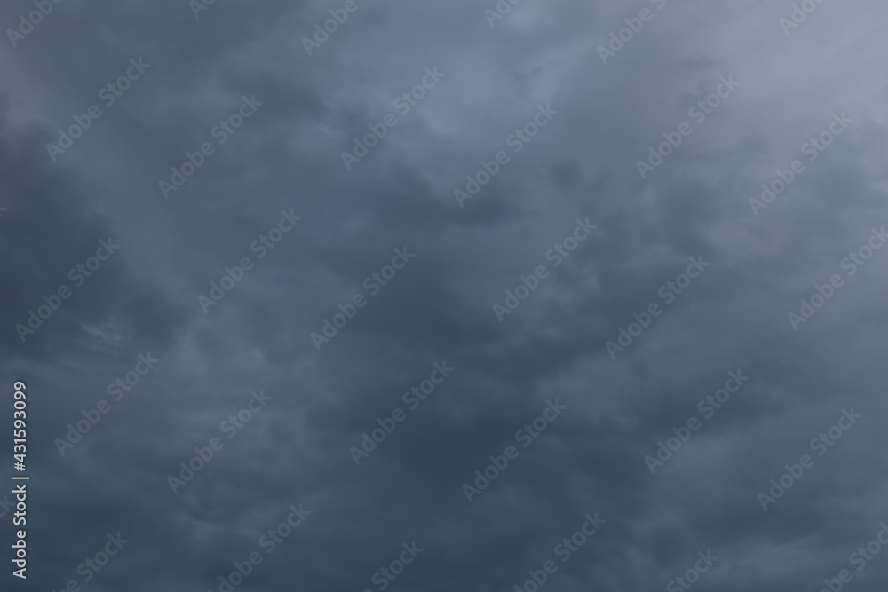 Evening dark blue rainy sky with clouds. Cloudy weather with overhanging rain. Heavy clouds Evening dark blue rainy sky with clouds. Cloudy weather with overhanging rain. Heavy clouds