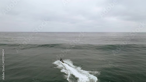 Jet ski in the sea during a storm surge, rescuing a big wave surfer, Pichilemu, Punta de Lobos Chile