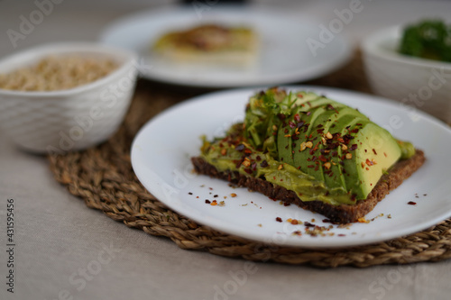 Green avocado dish with spices in a plate 