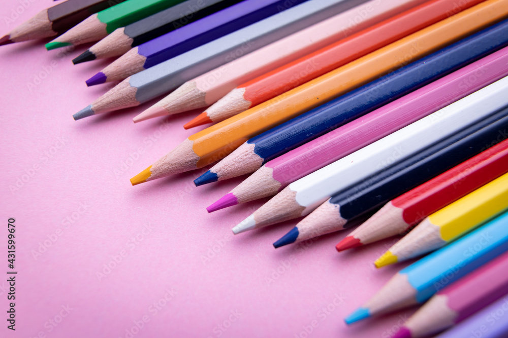 Colorful pencil set on pink background Colorful pencil set on pink background