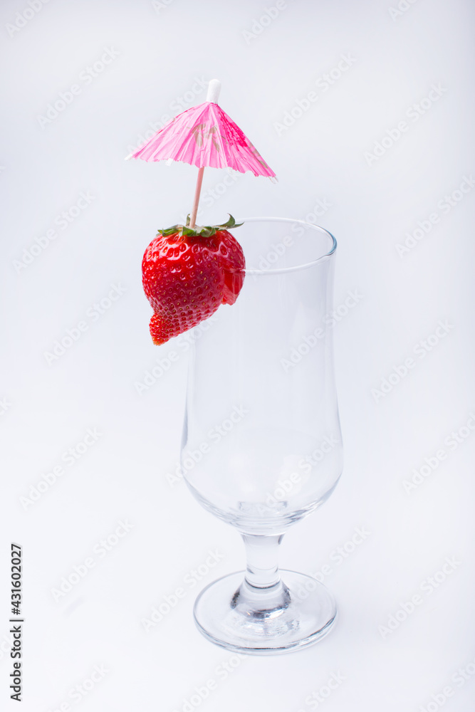 empty cocktail glass with red strawberries. On a white background empty cocktail glass with red strawberries. On a white background
