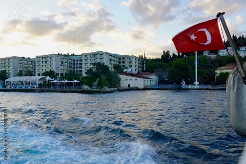 Istanbul, Bodrum - August 2020: Tour boats travel around the Bosphorus Canal on clear summer days. Sea cruise past Dolmabahce Palace