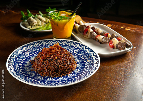 Traditional Middle Eastern food. Lebanese food. Arabian lamb barbecue, Mujadara rice and cabbage malfuf, drink
