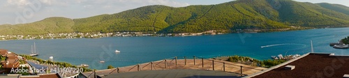 Panorama Landscape Bodrum with emerald lagoon one of the main attractions of Turkey. Natural beauty of Turkey. Mountains, green pines, turquoise ocean. Beautiful mountains, hills backround. Panorama