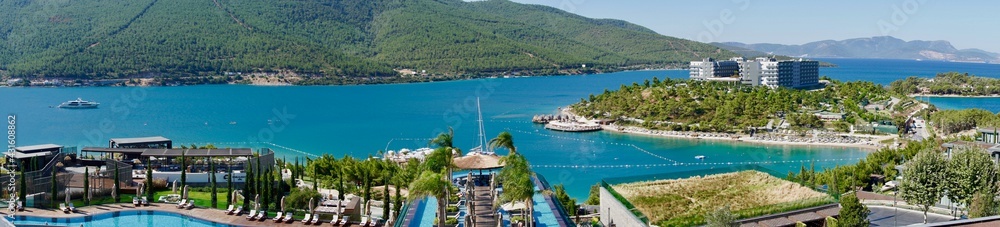 Stunning Turkey landmark of Island Bodrum. Tropic resort in lagoon with green exotic plants and trees. Greenery tropical nature at summer sunny day aerial view. Lux resort vacation conception
