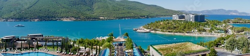 Stunning Turkey landmark of Island Bodrum. Tropic resort in lagoon with green exotic plants and trees. Greenery tropical nature at summer sunny day aerial view. Lux resort vacation conception