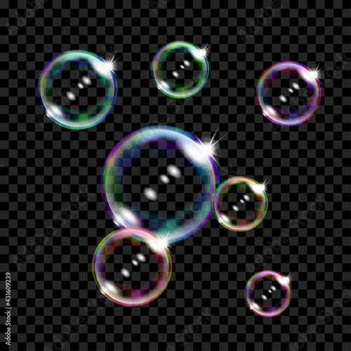 Set of several translucent colored soap bubbles on transparent background. Transparency only in vector format