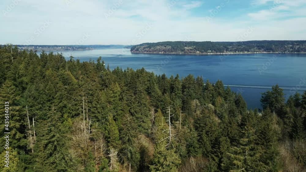 Aerial View Of Dense Green Forest At Point Defiance Park Overlooking Puget Sound In Tacoma, Washington, USA. Aerial View Of Dense Green Forest At Point Defiance Park Overlooking Puget Sound In Tacoma, Washington, USA.