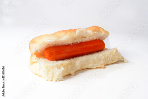 Sausages and hot dog bread on a white background photo