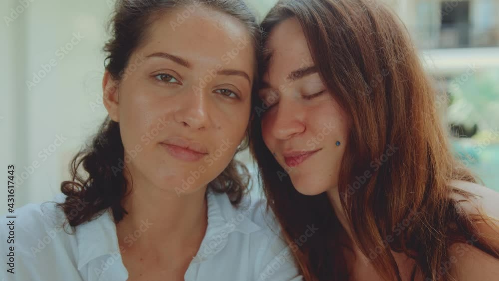 Portrait of lesbian couple looking into the camera Portrait of lesbian couple looking into the camera