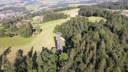 Aerial high drone shot flying around the Pfannenstiel observation tower in the canton of Zürich, Switzerland photo