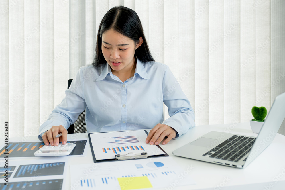 Businesswoman analysis the chart and meeting Video Conferencing with laptop at the home office for setting challenging business goals And planning to achieve the new target Businesswoman analysis the chart and meeting Video Conferencing with laptop at the home office for setting challenging business goals And planning to achieve the new target