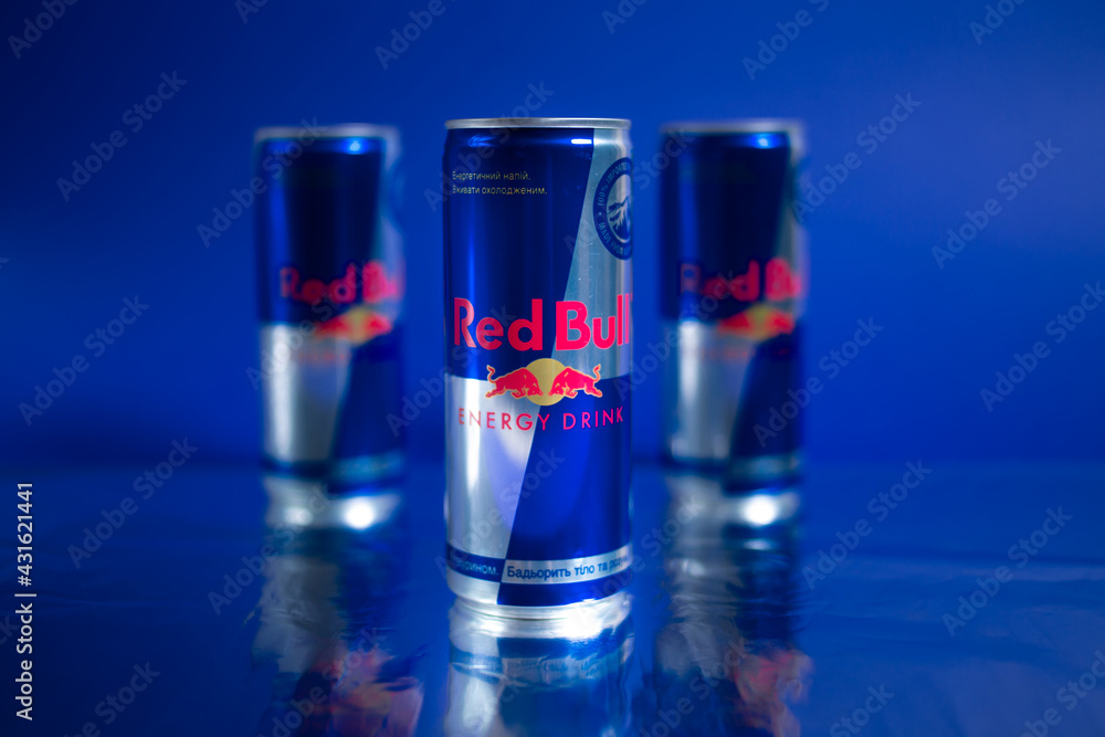 Kiev, Ukraine - May 9, 2021: Three cans of Red Bull energy drink on a blue  background. Stock-foto | Adobe Stock