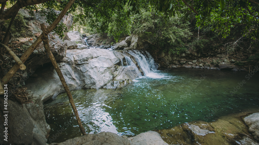 Waterfall in the forest in the middle of the valley. Waterfall in the forest in the middle of the valley.