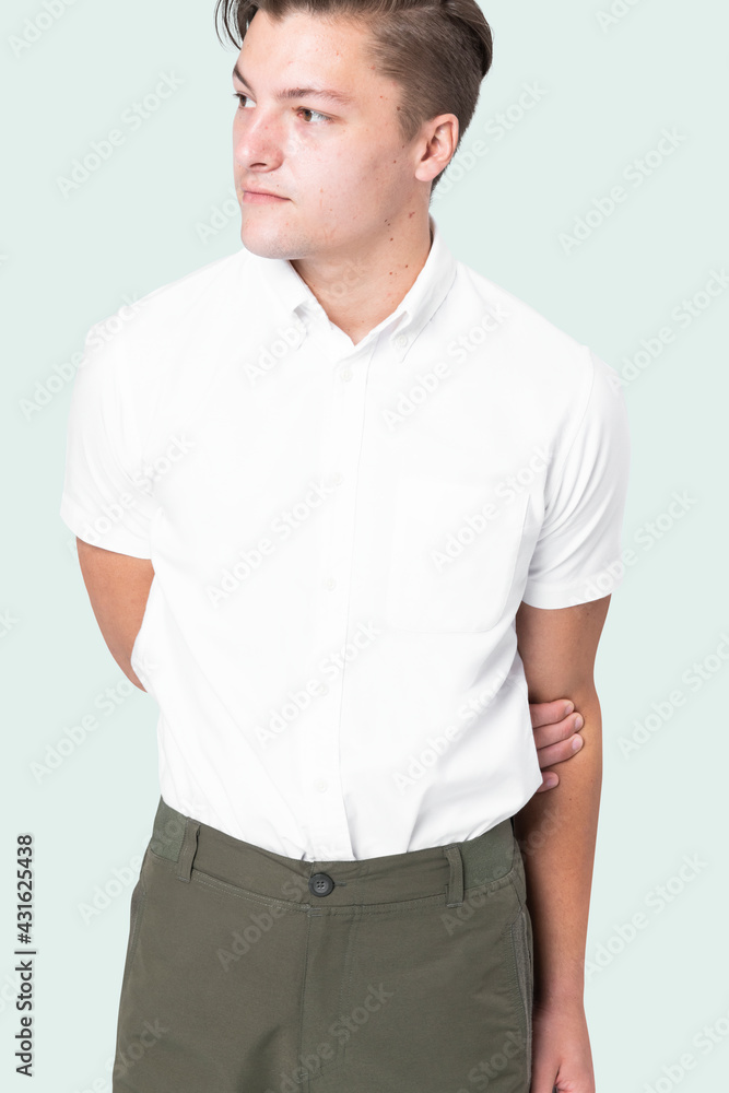 Man wearing white shirt with green pants Man wearing white shirt with green pants