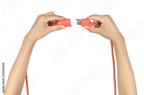 Hand holding orange extension cord isolated on white background photo