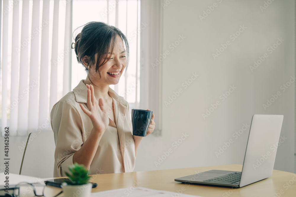 Attractive asian woman having video call via laptop at home office, Consultation, webinar, tutoring on internet, telecommuting concept Attractive asian woman having video call via laptop at home office, Consultation, webinar, tutoring on internet, telecommuting concept