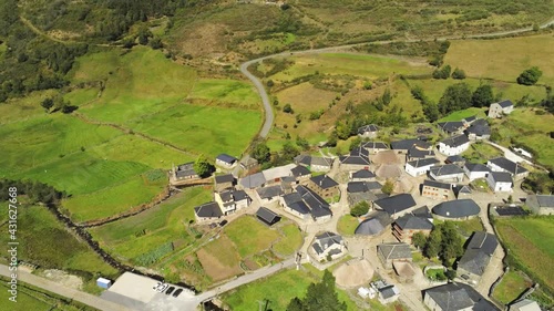 An aerial view of traditional houses with gray roofs in Balouta, Spain in 4K photo