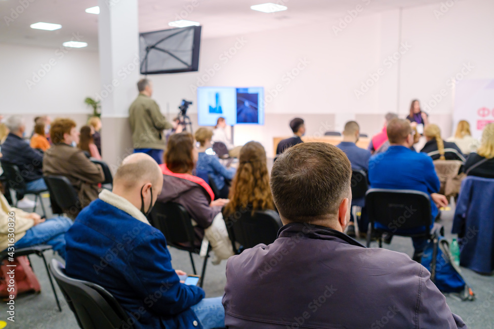 Fototapeta premium Business speaker doing presentation to audience