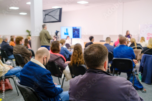 Business speaker doing presentation to audience