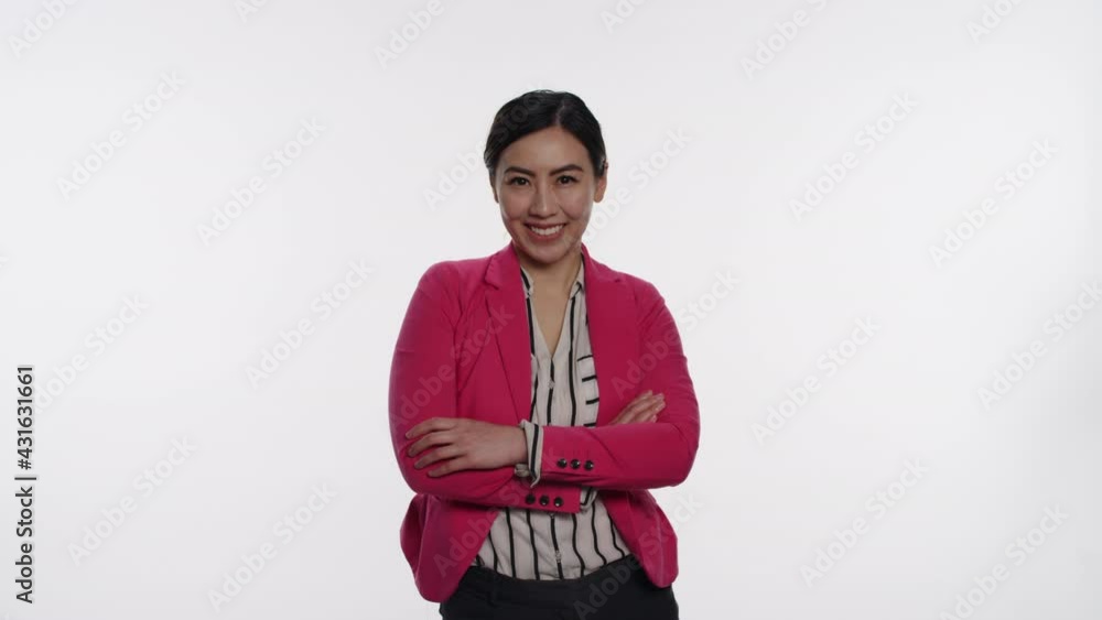 Pretty Asian woman confidently smiles on white background Pretty Asian woman confidently smiles on white background