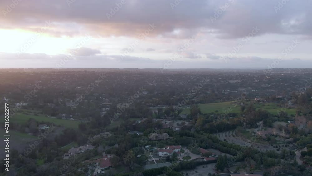 Aerial Shot Of Houses Against Cloudy Sky At Sunset, Drone Flying Forward Over Residential District - San Diego, California Aerial Shot Of Houses Against Cloudy Sky At Sunset, Drone Flying Forward Over Residential District - San Diego, California