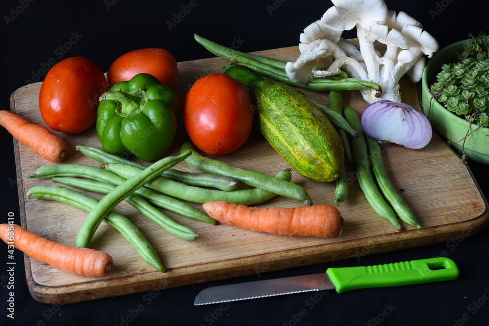 Vegetables on chopping board, tomatoes, bell pepper, beans . Vegetables on chopping board, tomatoes, bell pepper, beans .