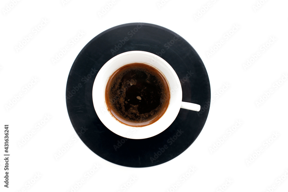 A cup of espresso coffee on an old vinyl record on a white background. Coffee break
A cup of espresso coffee on an old vinyl record on a white background. Coffee break