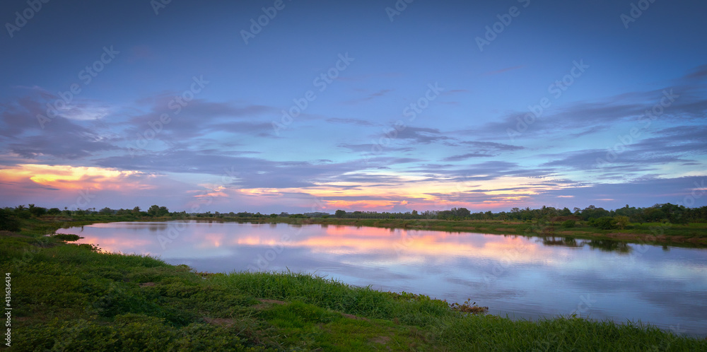 Scenery in the evening with a large pond