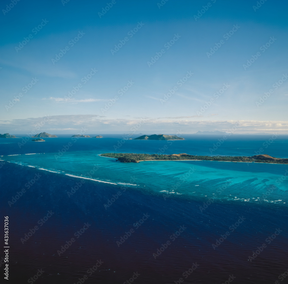 Aerial of a group of small pacific islands Aerial of a group of small pacific islands